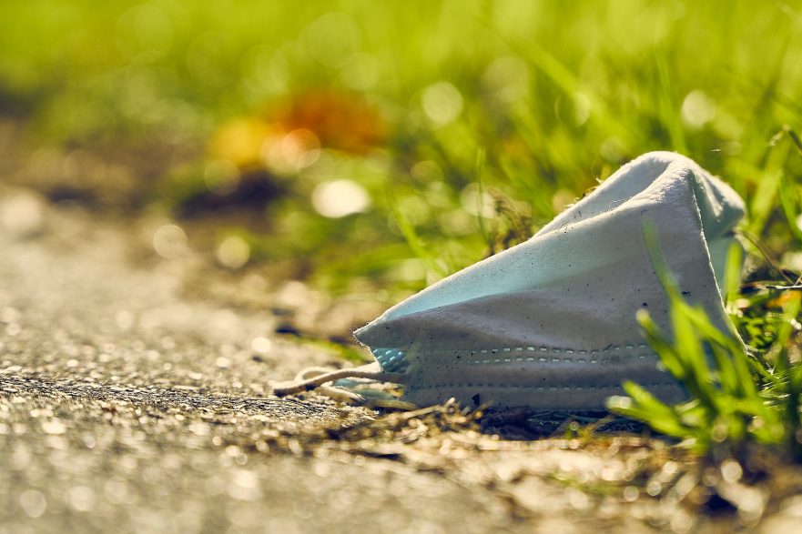 littered mask polluting environment